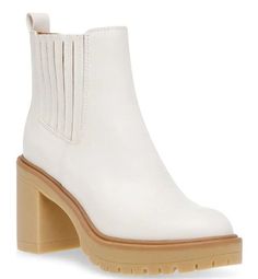 A lugged sole brings structure to this pair of booties lofted by a platform heel. True to size 3.5" heel 5" shaft, 10" calf circumference Round toe Inner zip closure Synthetic upper and sole Imported White Platform, Platform Heel, Platform Heels, Kids Accessories, Off White, Bring It On, Heels, White