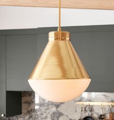 a light hanging from the ceiling in a kitchen