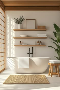 a white bath tub sitting in a bathroom next to a wooden shelf and potted plant