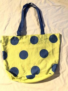 Old Navy Yellow And Blue Polka dots Tote Bag. Condition is Pre-owned. Shipped with USPS Priority Mail. PRICING We do not do deals directly through PayPal, as that is a violation of eBay policy. Please do not message us asking me to do so, and please realize that We use the buy it now option on all of our items. We do not prefer to negotiate prices. We offer the lowest price that we can . We want to make sure our listings are competitive. AUTHENTICITY All items are 100 percent authentic. Please b Blue Retro Canvas Bags, Blue Canvas Retro Bag, Retro Blue Canvas Bag, Retro Blue Cotton Bag, Vintage Blue Canvas Shoulder Bag, Casual Polka Dot Bags For Everyday Use, Polka Dot Tote Shoulder Bag For Daily Use, Polka Dot Tote Bag, Blue Polka Dots