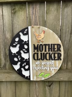 a wooden sign that says mother clucker we went expecting you with chickens on it