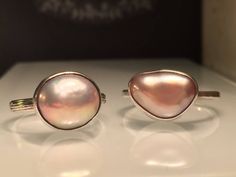 "Modern Pearl Ring. Unique Pearl Ring. Blush Pearl Ring. Solitare Pearl Ring. Trillion Pearl Ring. Pink Pearl Ring. Modern Pearl Ring. Beautifully Handcrafted upcycled bezel set Natural Cultured Pearl set on a lightly hammered solid sterling silver band.. This unique yet very versatile ring is a size 9 1/2 but is available in any size with a very similar Pearl and is sure to be your go to accessory and is perfect for wearing on any finger. . ❤️❤️Give the thoughtful gift of handcrafted. ❤️❤️ Grea Pink Teardrop Fine Jewelry Ring, Pink Teardrop Anniversary Ring, Pink Oval Stackable Jewelry, Pink Oval Stackable Rings, Pink Toe Ring Jewelry For Gift, Adjustable Pink Ring Fine Jewelry, Nickel-free Pink Rings For Weddings, Adjustable Pink Round Moonstone Ring, Pink Round Moonstone Ring For Gift