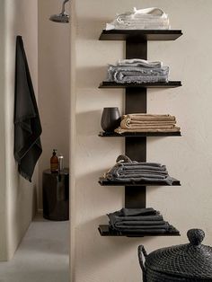 there is a shelf that has towels on it