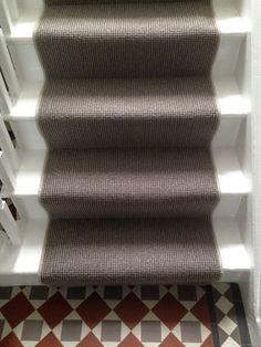 an image of stairs with carpet on them