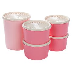 four pink plastic containers with white lids and rims are stacked on top of each other