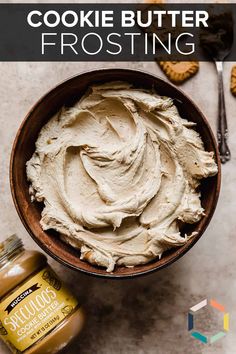 a bowl filled with frosting next to peanut butter