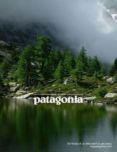 a lake surrounded by mountains and trees with the word patagonia written in white