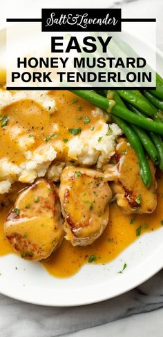 chicken with gravy and mashed potatoes served on a white plate, garnished with green beans