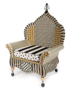 an upholstered chair with black and white checkered fabric on the back, sitting in front of a white background