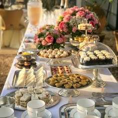 a table filled with lots of desserts and pastries