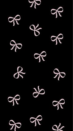 a black background with white bows on it