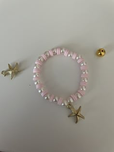 a bracelet with two starfish charms on it