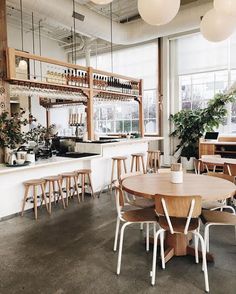 an empty restaurant with tables and chairs