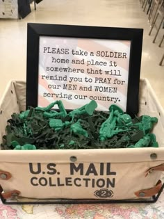 a mail box filled with green leaves and a sign that reads, please take a soldier home and place it somewhere that will remind you to pray for our men and women serving our