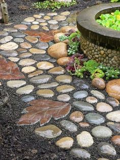 a stone path made out of rocks and gravel