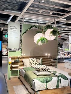 a bed room with a neatly made bed and hanging plants