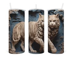 three candles with an image of a cat on the front, and one in the back