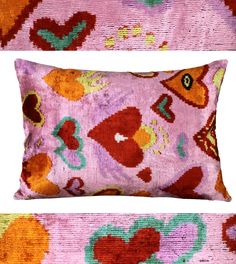 two pillows with hearts on them, one in pink and the other in oranges