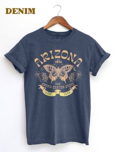 Thanks for checking out this Arizona State Butterfly graphic T-Shirt. This Retro BOHO design has the Arizona Swallowtail Butterfly  at the Main Motif for this Bohemian aesthetic Souvenir Tee.. Throw this shirt on with the Beautiful Grand Canyon State in your mind and soul. For the Comfort Colors 1717, The soft-washed, garment-dyed fabric has a weathered vintage look that hold up well, but soften over over time for a warm look. This fully customized tee is made 100% with ring-spun cotton. The dou Boho Tshirt, Boho Tshirts, Grand Canyon Arizona, Butterfly Shirt, Swallowtail Butterfly, Butterfly Shirts, Bohemian Aesthetic, Butterfly Graphic, Boho Design