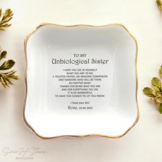 a white and gold plate with an unbiological sister poem on it