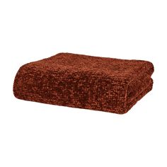 a brown blanket sitting on top of a white floor