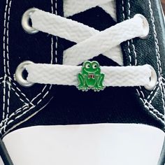 The Frog Charm is a single 8mm shoelace charm designed to add a whimsical touch to footwear. This slide charm has a delightful and cute frog design. Perfect for frog enthusiasts or as a frog lover gift, this accessory brings a playful and unique element to any pair of shoes. Express your love for frogs with this charming and distinctive shoe accessory, making a stylish statement for those who appreciate quirky and fun fashion details. Frog charms are also available for your Crocs!  Click here -- Frog Shoes, Custom Shoelaces, Shoelace Charm, Frog Jewelry, Hair Straightening Iron, Frog Design, Jewelry Tags, Green Frog, Cute Frogs