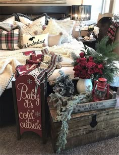 a bed room with a wooden box filled with christmas decorations