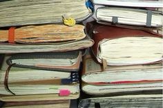 a pile of old books sitting on top of each other