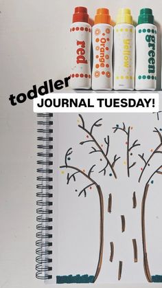 a spiral notebook with an image of a tree on it and the words toddler journal