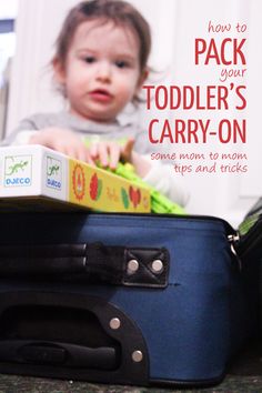 a baby sitting on top of a blue piece of luggage with the words how to pack your toddler's carry - on