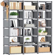 a book shelf filled with lots of books next to a vase and other items on top of it