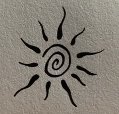 a drawing of a sun on the wall