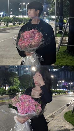 a man and woman holding flowers in their hands on the side of the road at night