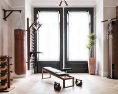 an empty gym room with black and white accents