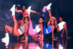 the cast of dancing with their legs spread out