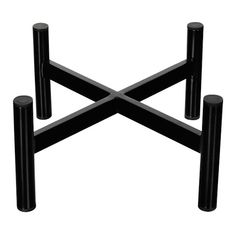 three black poles are stacked on top of each other in the shape of an x