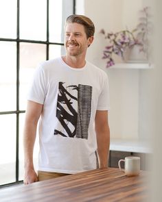 Our best-selling, artist-created graphic tee. VESTIGE designs take inspiration from modern art and NYC— where the brand was born. The shirt is cut in soft cotton and screen printed with our exclusive in-house design. White Graphic T-shirt, Graphic Design Cotton T-shirt, Artsy Graphic Design Cotton T-shirt, Modern Cotton Shirt With Graphic Print, Modern Cotton Tops With Screen Print, Artsy Cotton T-shirt With Graphic Design, Artsy Cotton Shirt With Graphic Design, Artsy Cotton Graphic Print T-shirt, Hand Printed T-shirt For Summer Streetwear