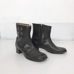 "60's brown vinyl ankle boots have a grommet/ lace detail on the shaft, and a faux shearling lining. The boots have as square toe, rubber stacked heel, textured rubber sole, and a talon side zipper on the inside shaft. Label is Bootinos by B.F. Goodrich. Condition Overall excellent, insole has slight matting from wear, but soles show very little wear. Measurements Insole 10.25 Width 3.5\" Heel height 2\" Would best fit a size 8 1/2, and tag size is a.n 8.1/2M." Womens Booties, Booties Ankle Boots, Cotton Lace, Stacked Heel, Boot Shoes Women, Lace Detail, Side Zipper, Bootie Boots, Rubber Sole