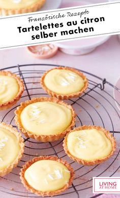 small tarteltes on a wire rack with lemon sauce in them and the words tarteltes au citron selber machen