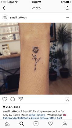 a single rose tattoo on the wrist