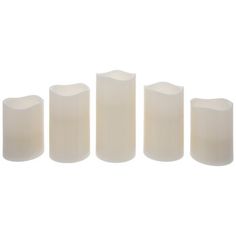 five white candles are lined up in a row