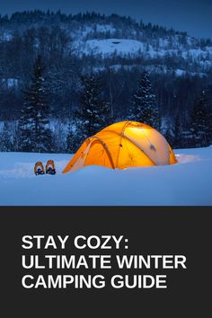 a yellow tent sitting in the snow with text that reads stay cozy ultimate winter camping guide