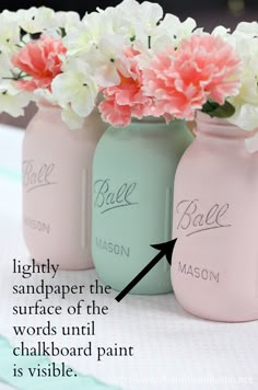 three mason jars with pink and white flowers in them, labeled lighty sandpaper the surface of the words uni chalkboard paint is visible