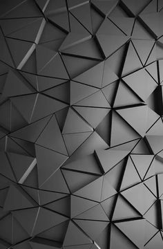 an abstract black and white photo with lots of small triangles in the middle of it