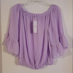 New With Tags. Perfect Condition. Purple Summer Blouse For Brunch, Summer Purple Blouse For Brunch, Lavender Ruffled Blouse For Summer, Purple Ruffled Blouse For Spring, Purple Summer Tops For Brunch, Lavender Ruffled Tops For Spring, Purple Feminine Blouse For Brunch, Feminine Purple Blouse For Brunch, Trendy Purple Summer Blouse