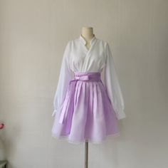 This is a Korean Modern Hanbok wrap style mini skirt for Women. This skirt is made of three layers, so it is beautiful without having to wear an underskirt with a natural voluminous feel. This hanbok is modernly designed so you can wear it comfortably and beautifully. This modern hanbok is perfect dress for daily and celebrations such as parties or various events. ⭐This skirt can be made in custom sizes. Please contact me if you would like to make your size. ⭐Please check out the link below for the white blouse in the photo. https://www.etsy.com/listing/1568387737/ ✔️Washing Method Dry cleaning is recommended for the first wash. Washable, please hand wash separately. Washing by twisting with excessive force may damage clothes. ⭐It can be matched with a variety of blouses top to create a be White Wrap Skirt For Spring Party, Korean Skirt Outfits, Hanbok Skirt, Hanbok Women, Modern Hanbok Dress, Casual Party Dress, Clothing Korean, Korean Skirt, King Outfit