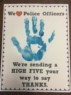 a hand print with the words we love police officers, were sending a high five your way to say thanks