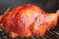 a close up of a chicken on a grill