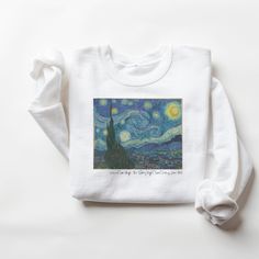 Vincent van Gogh celebrates his 170th birthday this year. Why not pay homage to the great artist with our Starry Night Crewneck Sweatshirt. If you love beautiful art, and you like to incorporate beautiful pieces into your wardrobe to appreciate every day, you'll love this sweater.  Also available in a T-Shirt Here: https://www.etsy.com/listing/1450765121/classic-art-t-shirt-stary-night-tshirt?click_key=18296c95de95ffc6659928f83b29fa3702796455%3A1450765121&click_sum=dc14cabf&ref=shop_home_active_1 These garments are made from polyester and cotton. This combination helps designs come out looking fresh and beautiful. The collar is ribbed knit, so it retains its shape even after washing. There are no itchy side seams on these sweaters.  .: 50% cotton, 50% polyester .: Medium-heavy fabric (8.0 Starry Night Sweater, Mountain Biker Gifts, Vincent Van Gogh Starry Night, Bulldog Tshirt, Outfit Pieces, Unique Sweatshirt, Bike Shirts, Starry Night Van Gogh, Personalized Teacher Gifts