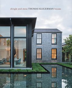 the front cover of a book with an image of a house and its reflection in water